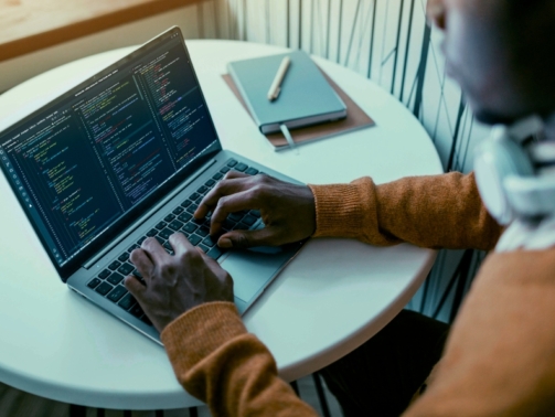 high-angle-man-working-laptop